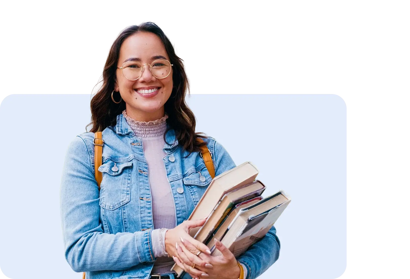Female student smiling with books