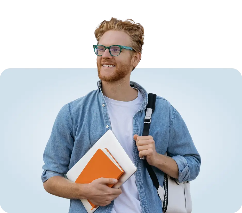 smiling ginger student with laptop and backpack
