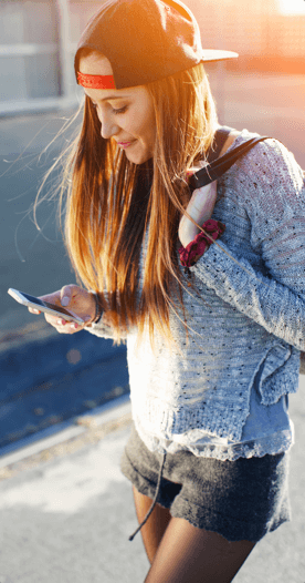 A woman staring at her cell phone