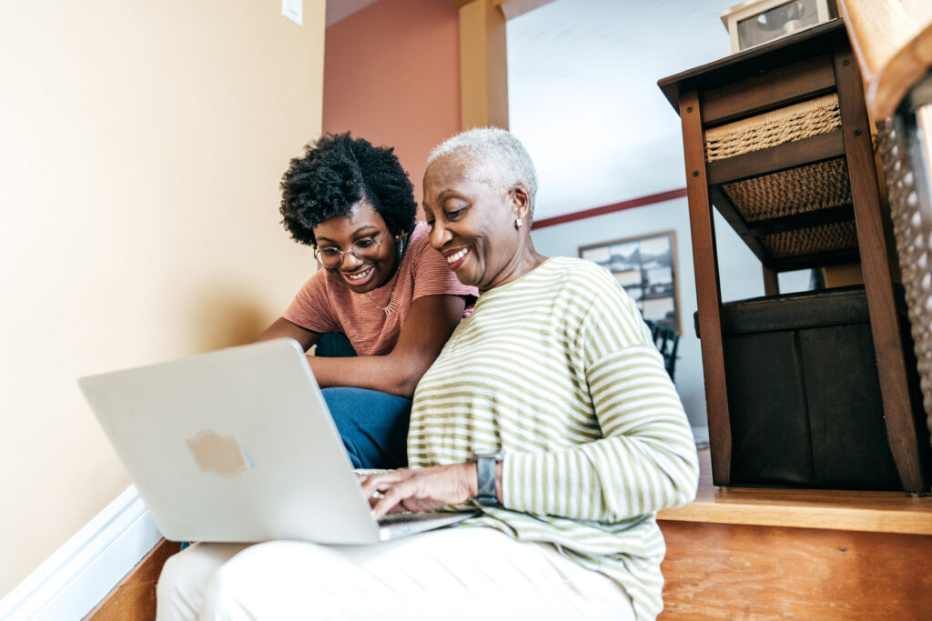 Student and family using computer to research student loans with a cosigner