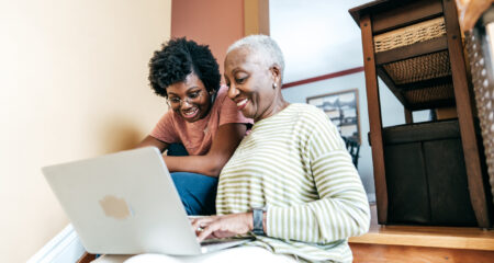 Student and family using computer to research student loans with a cosigner