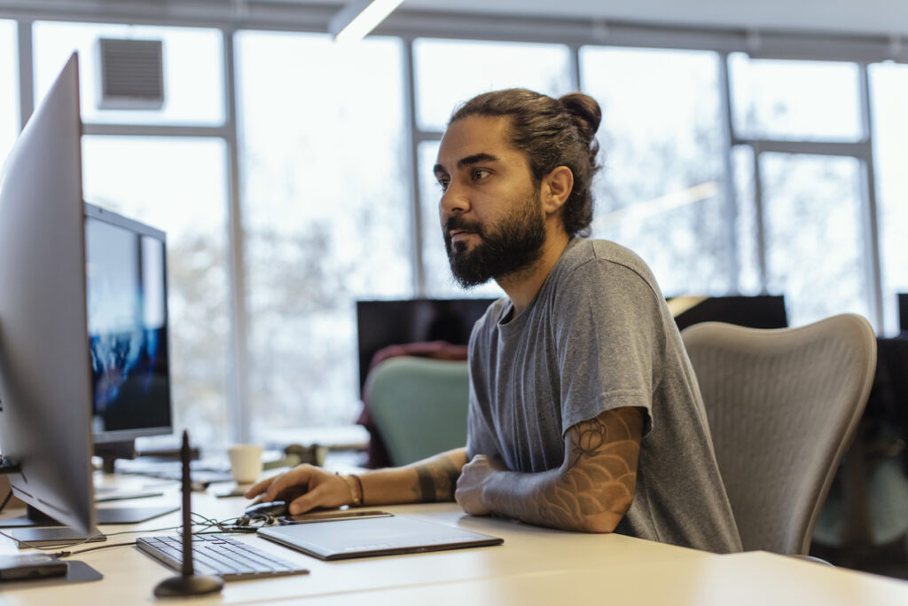 Image of man at a computer.