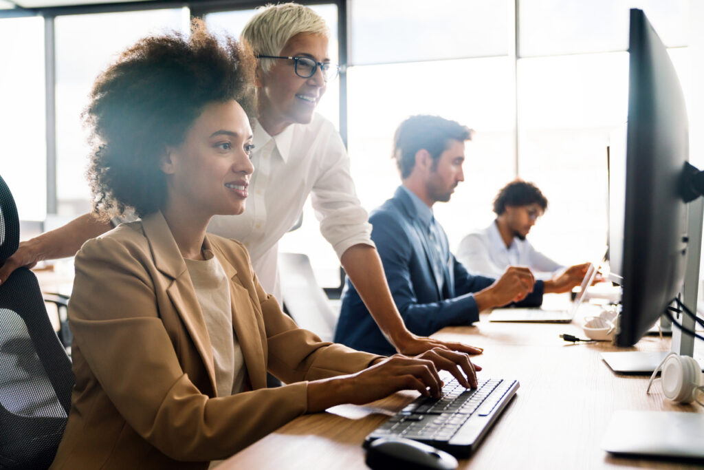 Group of business people working together, brainstorming in office