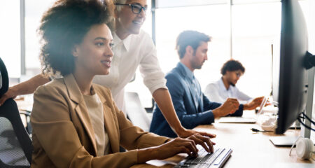 Group of business people working together, brainstorming in office