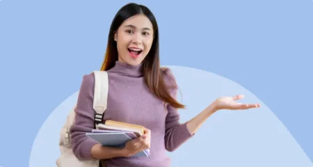 student holding books and bag
