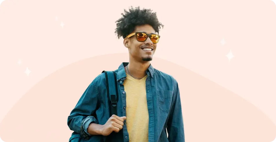 College student with backpack smiling - mobile